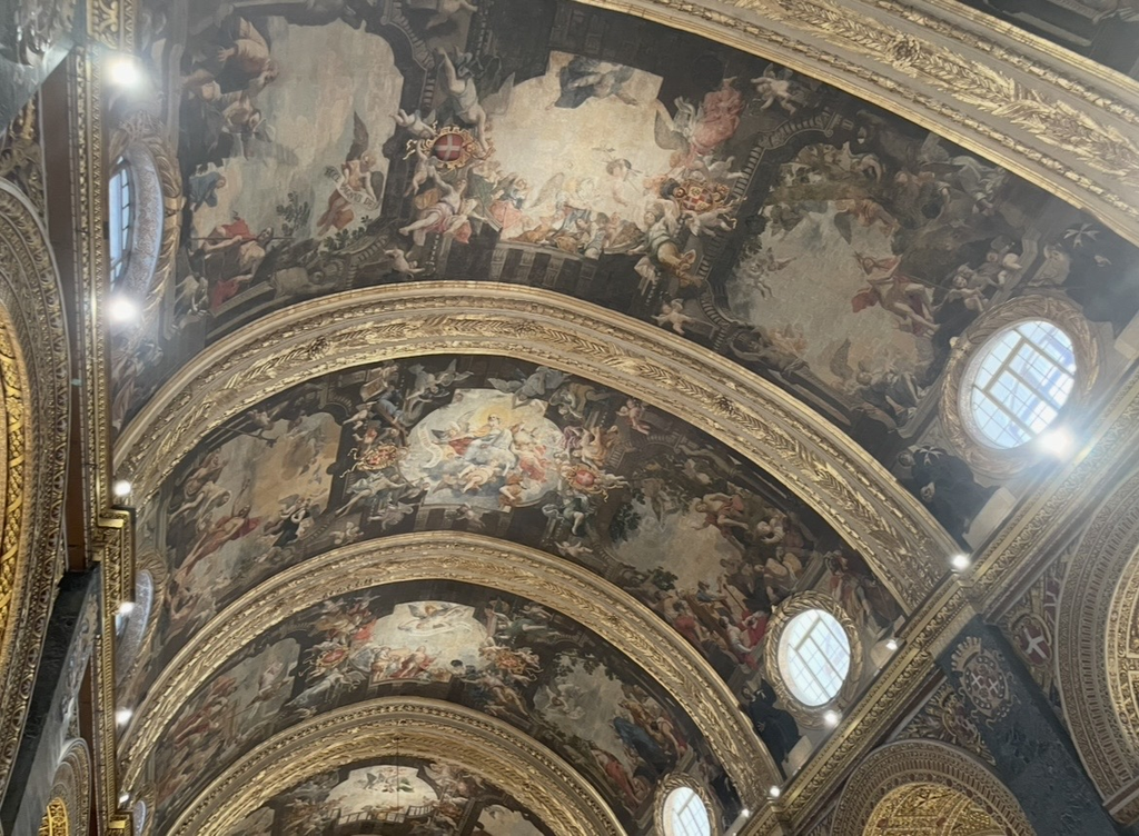 The grand Baroque ceiling of St. John’s Co‑Cathedral, featuring 18 vivid scenes painted by Mattia Preti depicting the life of St. John. Rich ornamentation and dynamic compositions make this one of Malta’s most celebrated historic masterpieces.