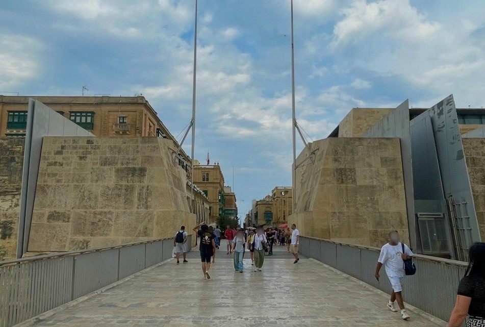 Valletta’s City Gate, where modern stone architecture contrasts with the historic buildings of the old town, creating a striking and symbolic entrance to the city.